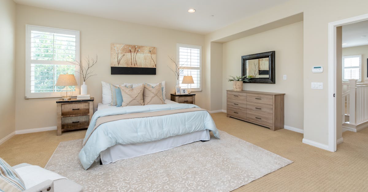 Cozy bedroom featuring bouclé bed and warm decor